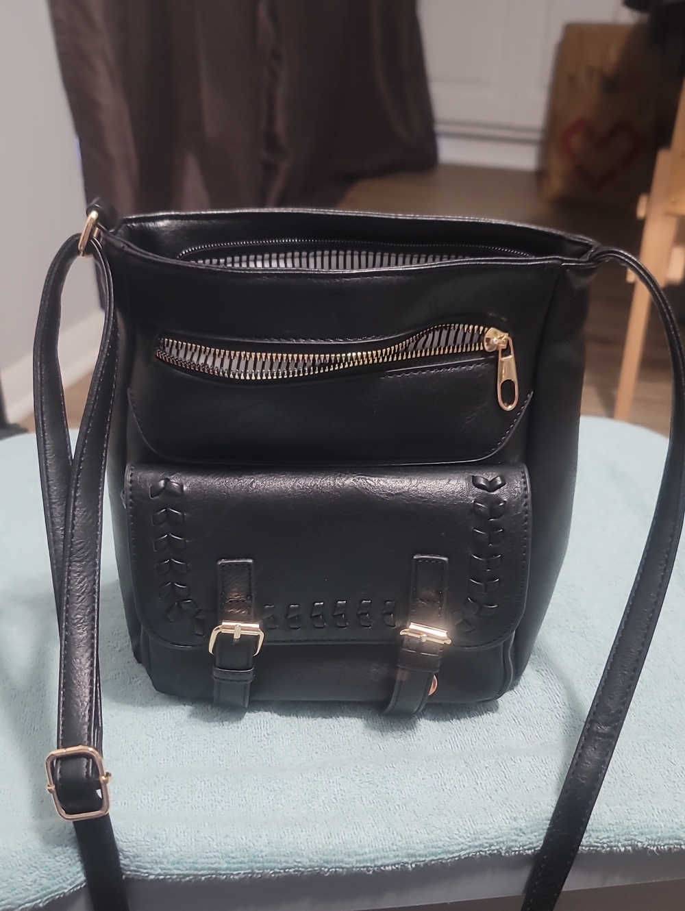 Classic Black Crossbody Bucket Bag with Gold Hardware